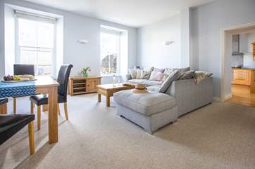 The light and bright living space has views over the water sports centre and to the sea beyond.