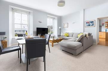 The stylish sitting-room is ever so comfortable, enjoy looking out towards the docks and sea at the ever-changing view.