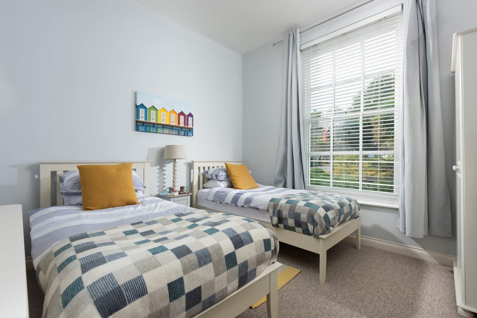 The twin bedroom is decorated in tranquil, calming tones. 