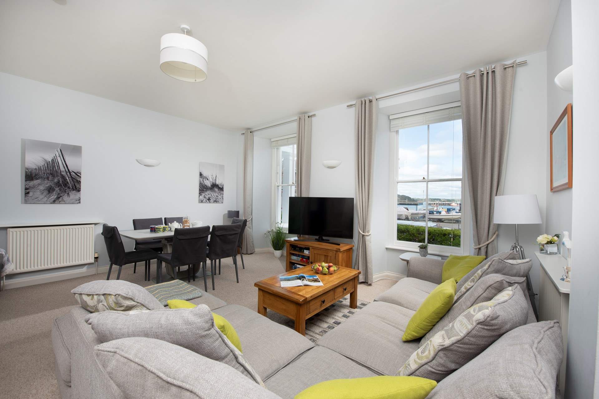 The light and bright living space has views over the water sports centre and to the sea beyond. 