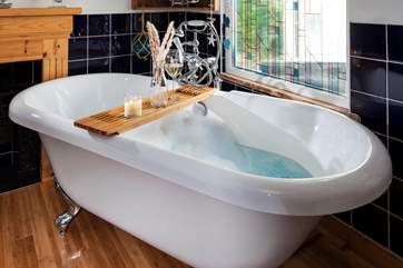 The stylish bathroom has a wonderful roll-top bath which is just the perfect spot for a long soak after a day’s activities.