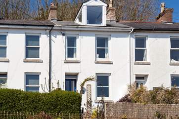 Welcome to Lowenhe. Set in an elevated position, six granite steps take you up to the front door.