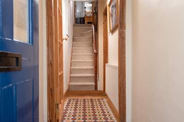 Your typical Cornish cottage staircase, steep and narrow, leading to the bedrooms and the bathroom. At the top of the stairs there is a stepped landing, leading into the bathroom and then onto the bedrooms.