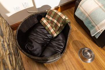 A custom dog bed awaits the family pooch.