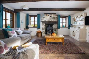 Get comfortable in front of the cosy wood-burner.