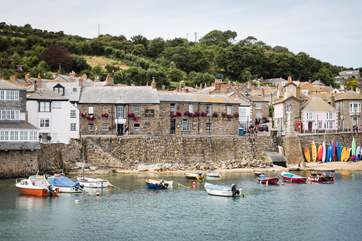 Your location is so special that with a hop, skip and a jump from the front door you can be at the harbourside enjoying the sandy beach and bustle of Mousehole's glorious harbour, watching the fishing boats bobbing away.