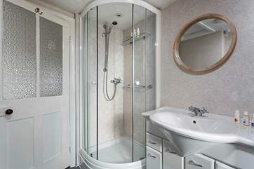 The family bathroom has a separate shower cubicle.