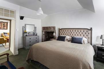 On the first floor, leading off from the sitting-room, is the main bedroom with en suite shower-room.