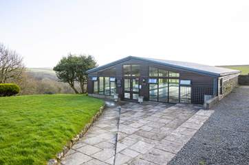 The swimming pool is only a short stroll from the cottage.