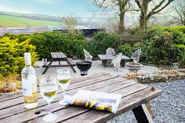 A shared area for guests to sit and barbecue on a warm summer evening whilst enjoying the views.