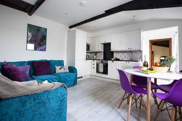 The open plan living-room is a bright and comfortable space.