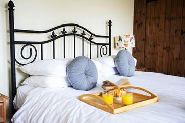 Bedroom 1 offers a place to recharge.