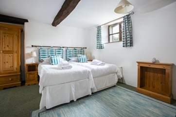 Bedroom 2 with twin beds is a lovely bright room.