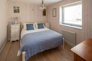 Bedroom one has a lovely seaside feel.