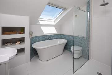 En suite to bedroom three is home to this wonderful bath and huge shower.