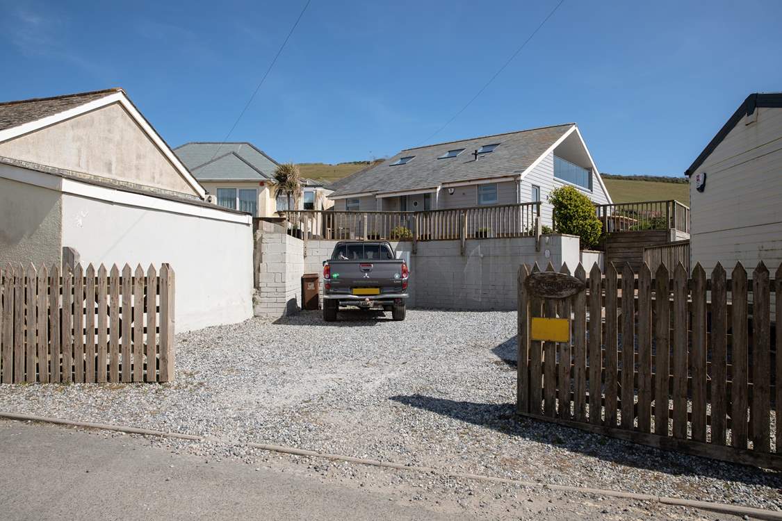 Your gravelled parking area can fit numerous cars.