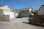 Your gravelled parking area can fit numerous cars.