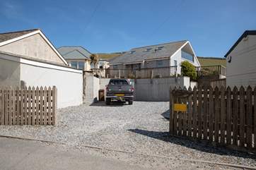 Your gravelled parking area can fit numerous cars.