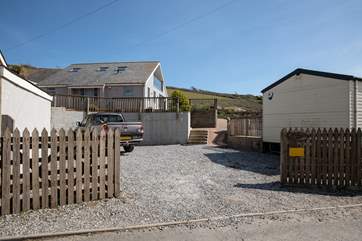 Your gravelled parking area can fit numerous cars.