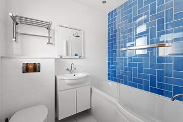 The family bathroom on the ground floor is located next to bedroom two.