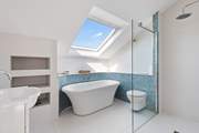 En suite to bedroom three is home to this wonderful bath and huge shower.