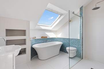 En suite to bedroom three is home to this wonderful bath and huge shower.