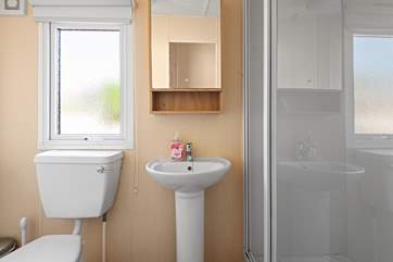The beach hut bathroom with shower.