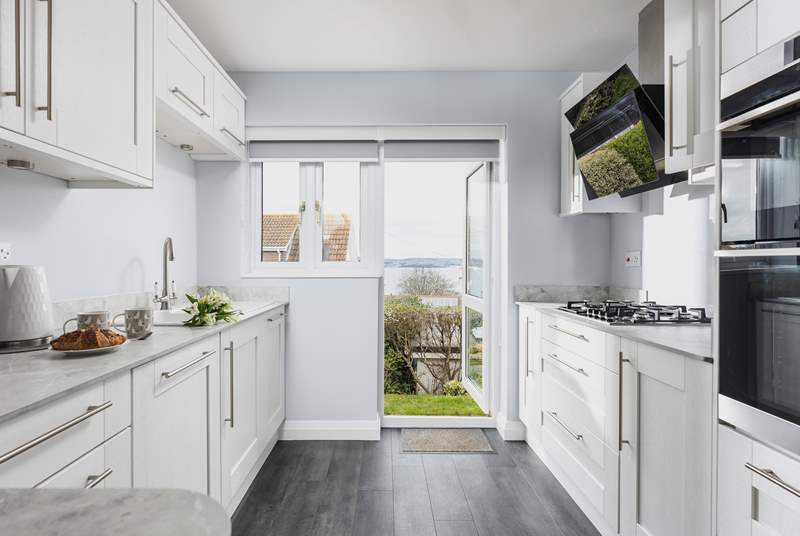 Swing open the kitchen door to be treated to these fabulous views and fresh sea air. Please mind the step when entering the back garden path.