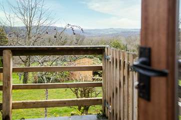 The patio door leads you outside onto the terrace with steps down to the enclosed garden.