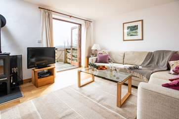 The living area has direct access to the terrace, perfect for al fresco dining.