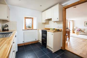 Cook up a storm in the well-equipped kitchen whilst chatting to guests in the open plan living space.
