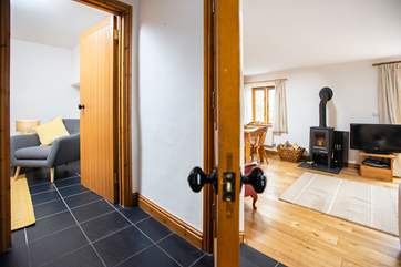 The snug is located just off the main living area and has a Smart TV.