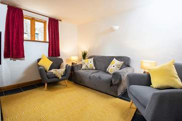 The cosy snug with a wall-mounted TV. The curtains will be updated to match with the rest of the room.