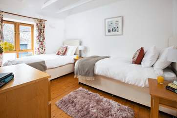 This 'zip and link' room can be made up as twins or a double bed.
The owners' house can be seen from the windows but this cottage faces away making for a private holiday.