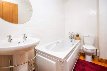 The bathroom on the first floor, situated next to the twin room.