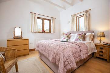 With dual-aspect windows, a good night's sleep is assured in the main bedroom.
