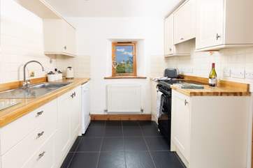 Cook up a storm in the well-equipped kitchen whilst chatting to guests in the open plan living space.
