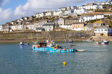 Spend time in Mevagissey watching the fishing boats come into the harbour.