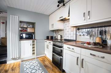 The kitchen leads through to the utility and a ground floor shower-room.