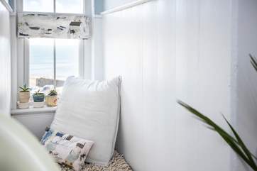 This bedroom has sea views too and a lovely window seat from where to enjoy them.