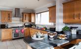 The stylish kitchen with room to cook and room to dine at the breakfast-bar. - Thumbnail Image