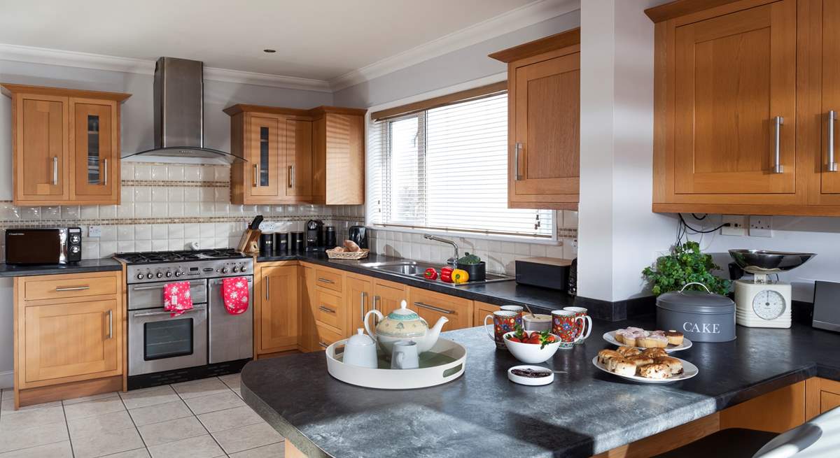 The stylish kitchen with room to cook and room to dine at the breakfast-bar.