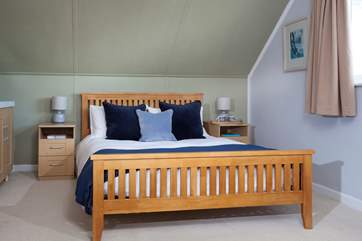 Bedroom three has a king-size bed.