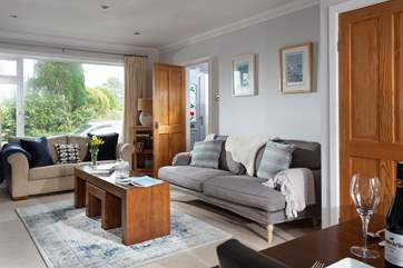 Comfy sofas and quality furnishings surround you.
