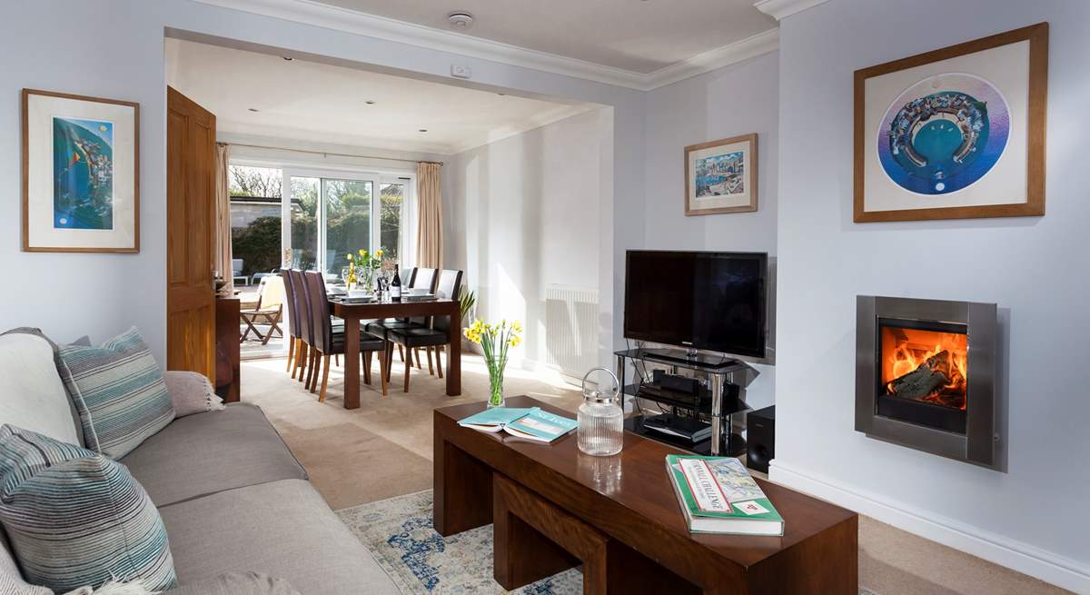 The cosy and comfy sitting-area leads through to the dining-area which overlooks the garden.