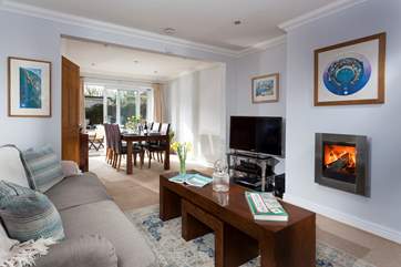 The cosy and comfy sitting-area leads through to the dining-area which overlooks the garden.