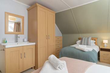 There is storage for your belongings and a sink in bedroom two.