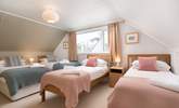 Bedroom 2 is a quad room with four single beds on the first floor. - Thumbnail Image