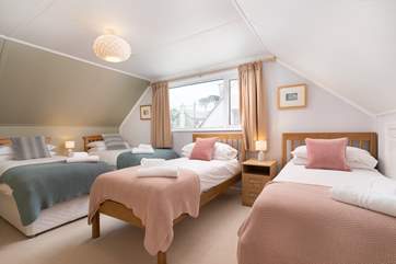 Bedroom two is a quad room with four single beds on the first floor.