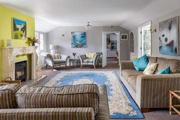The light and airy sitting-room is the perfect place to relax.